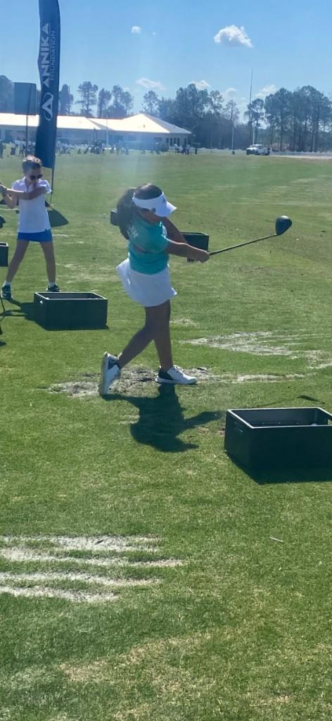 Alex practicing at the driving range